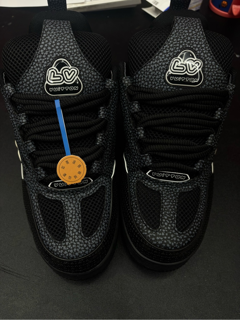 Black and white LV sneakers